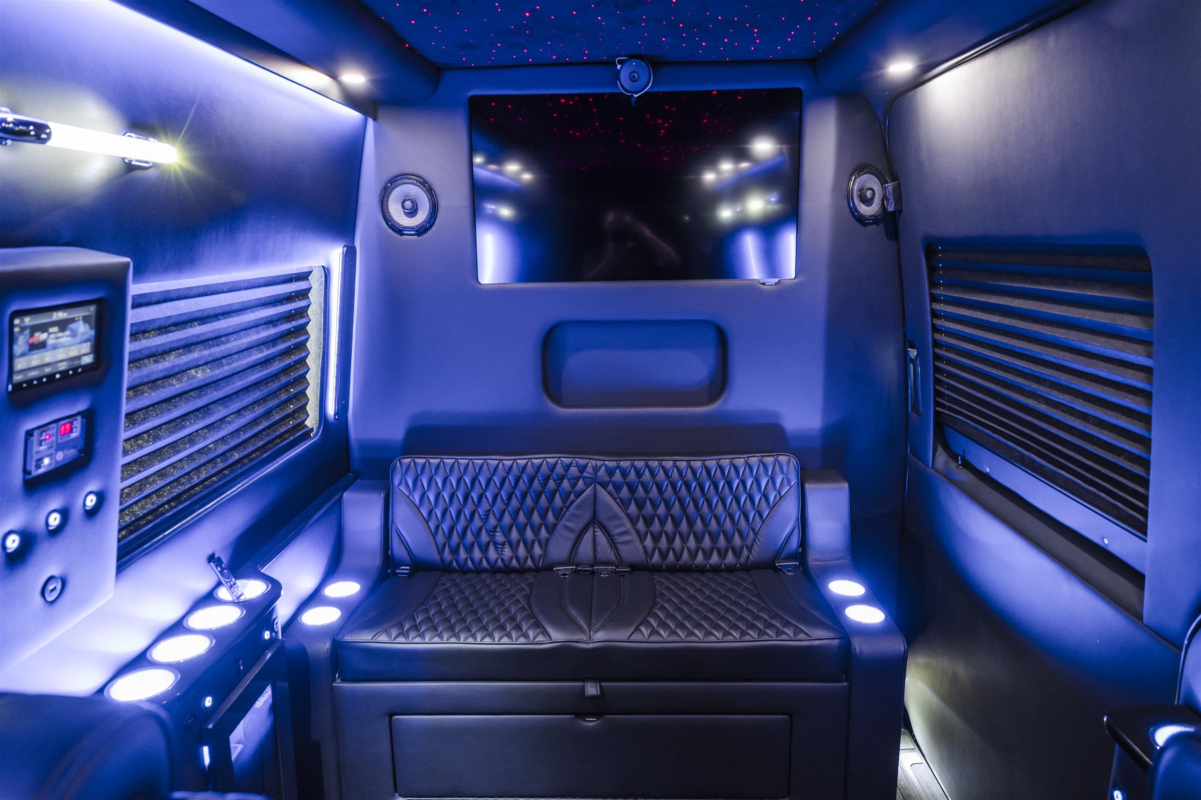 Black lounge cabin layout inside a luxury van