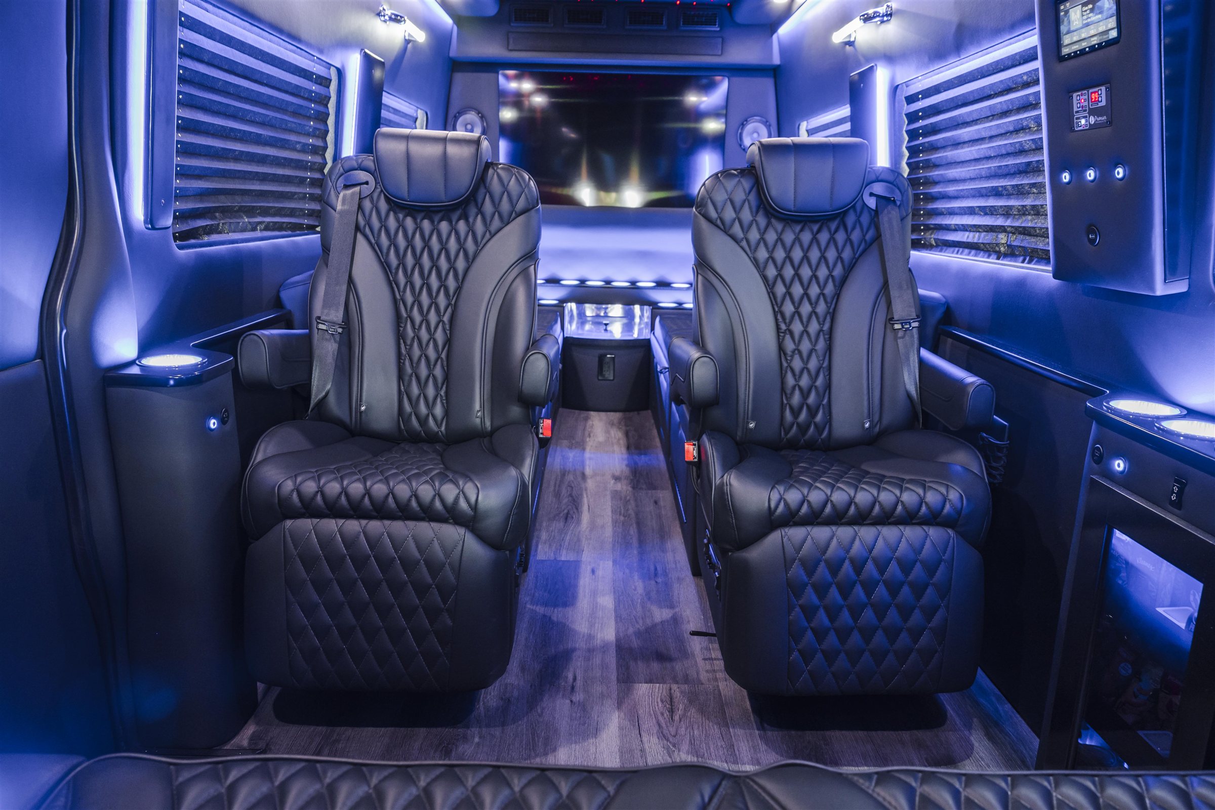 Blue leather cabin inside a Regency luxury van