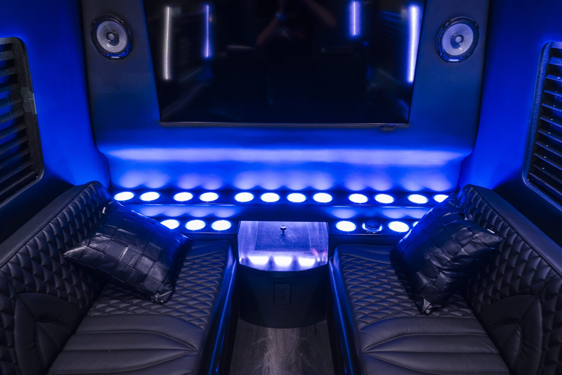 Rear lounge layout inside a premium van