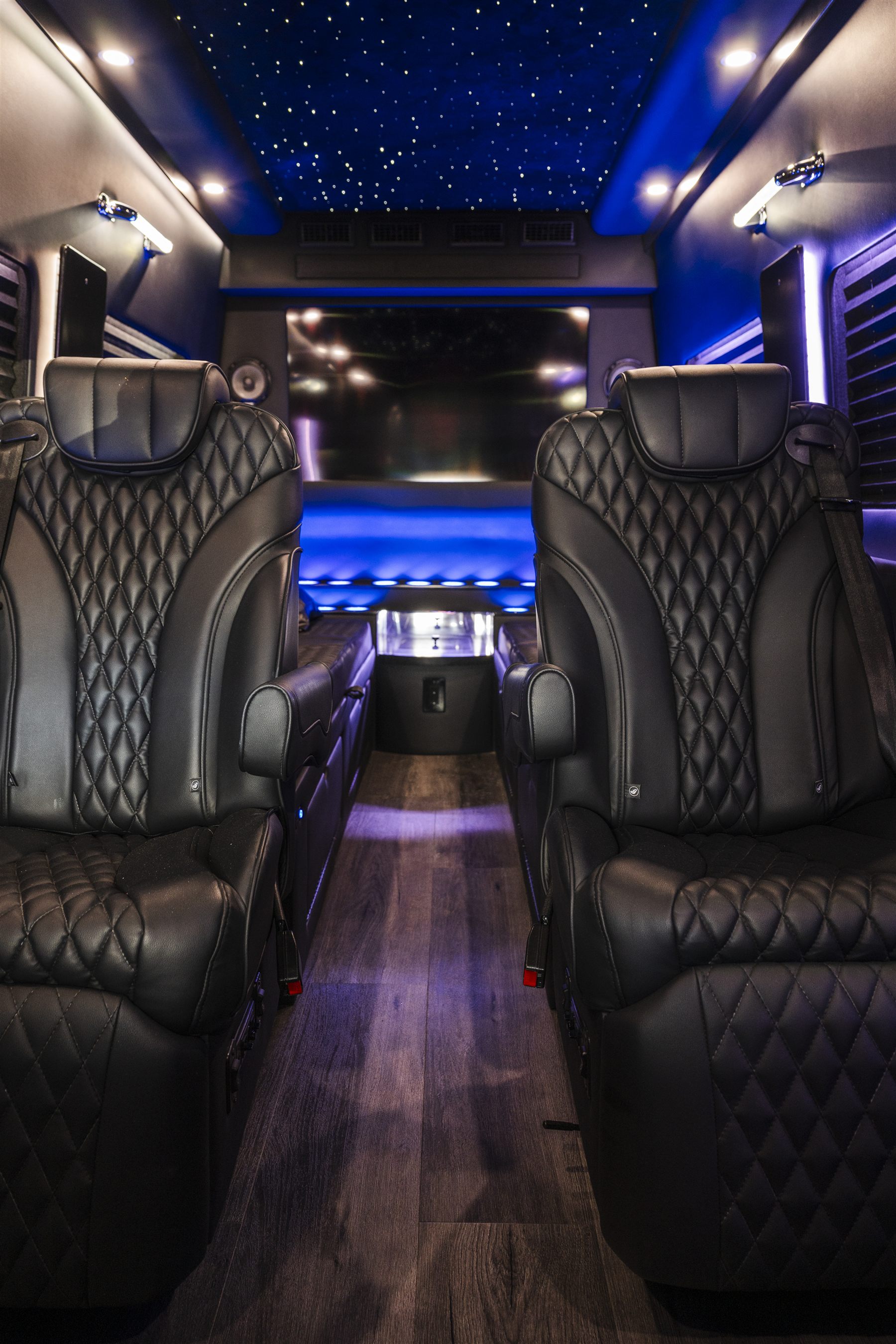 Theater-style seating layout inside a luxury van